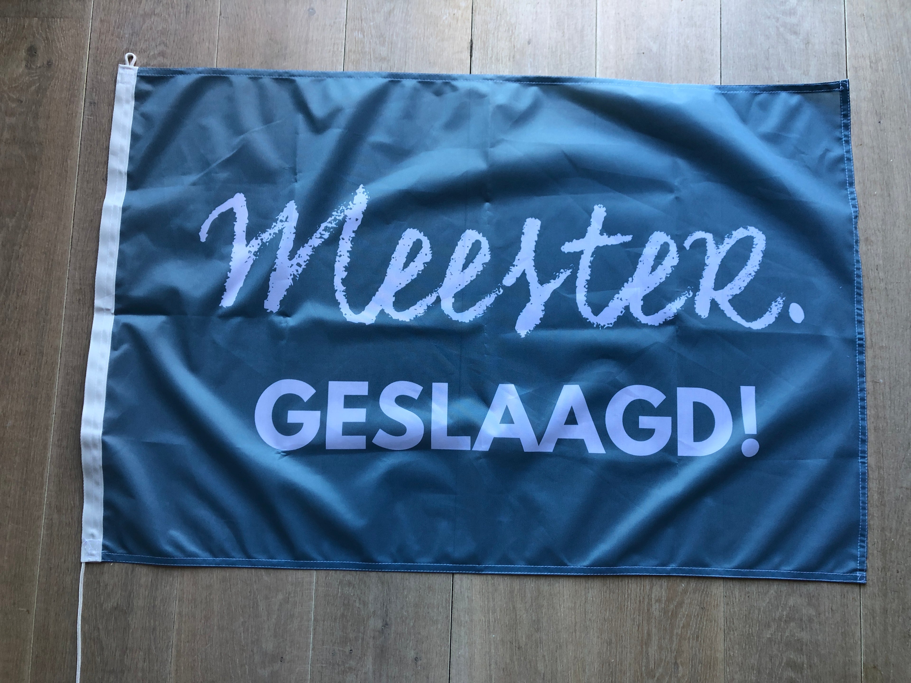 MEESTER. geslaagd vlag