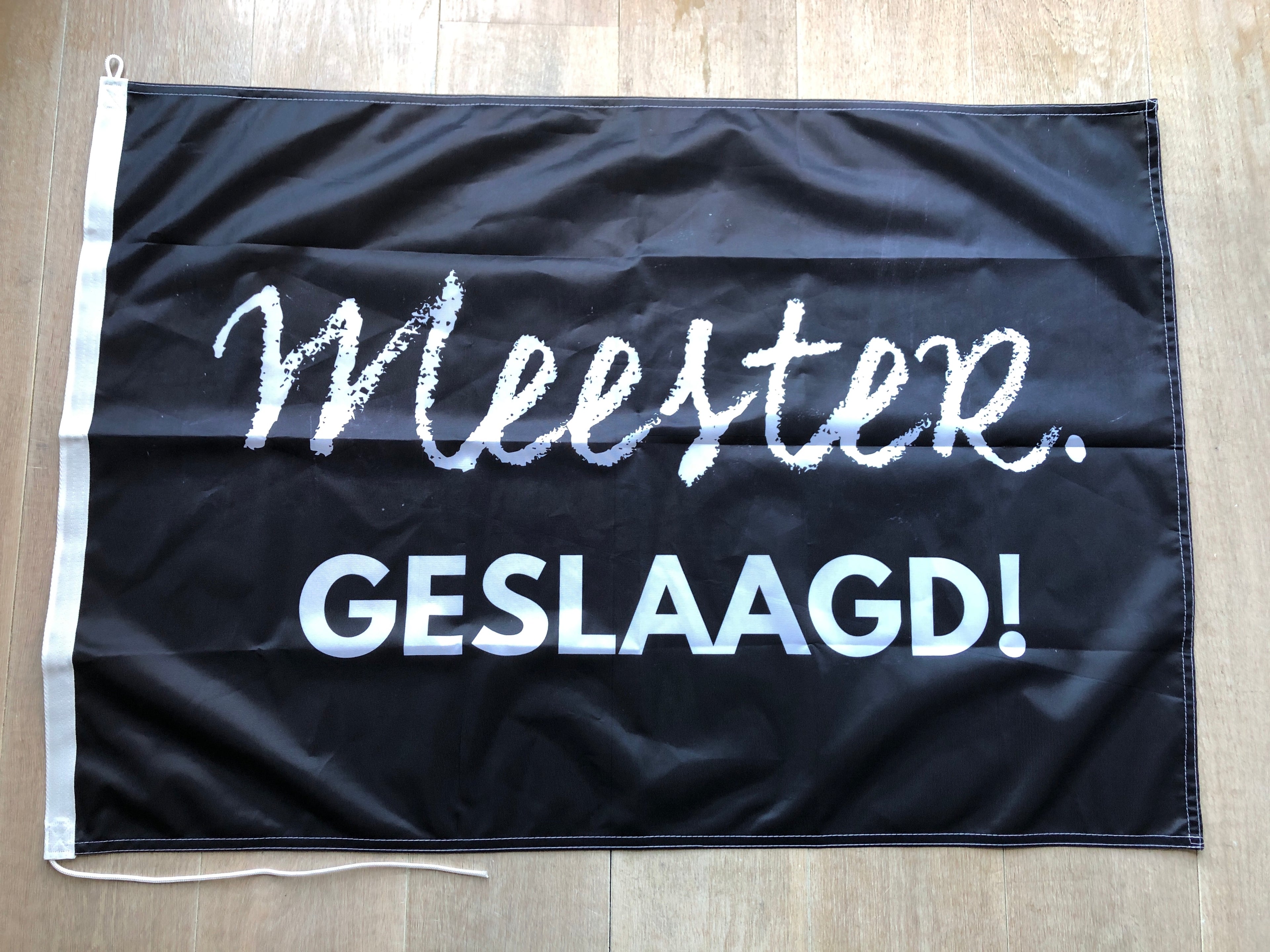 MEESTER. geslaagd vlag