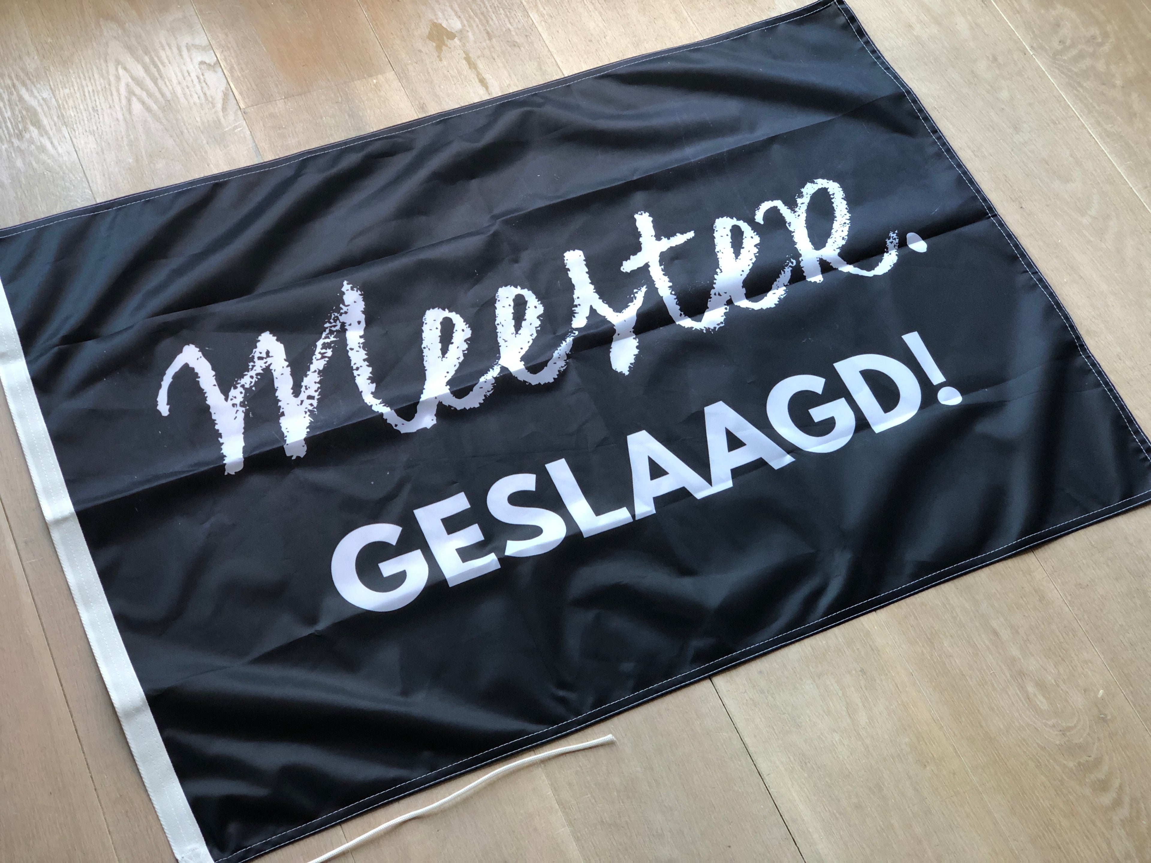 MEESTER. geslaagd vlag
